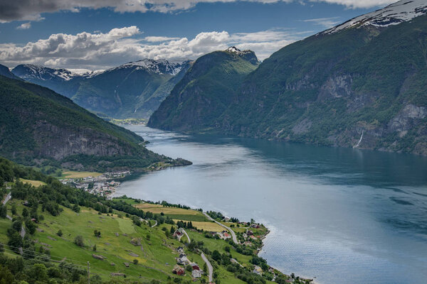 Amazing nature view with fjord and mountains. Beautiful reflection. Location: Scandinavian Mountains, Norway. Artistic picture. Beauty world. The feeling of complete freedom