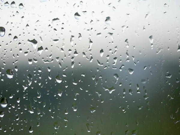 Gotas de chuva no vidro da janela — Fotografia de Stock