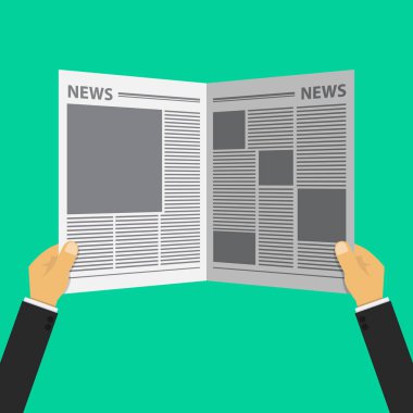 Bir çift el gazeteyi tutuyor.