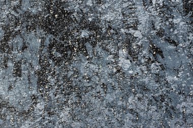 Mavi ve siyah boyalı arka plan beyaz speckles ile dokulu.