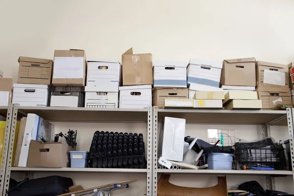 Stack Office Supplies Piled High Storage Room Includes Bankers Boxes — Stock Photo, Image