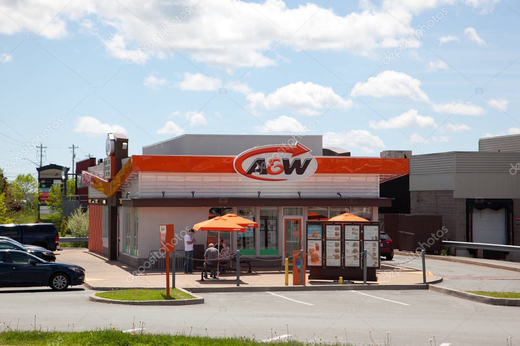 Sackville, Nova Scotia, Canada- June 15, 2019: A&W Restaurant outside on a sunny day with patio tables