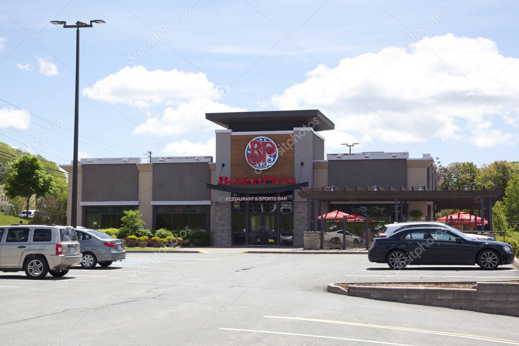 Sackville, Nova Scotia, Canada- June 15, 2019:  Daytime view across the parking lot of a Boston Pizza franchise