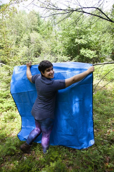 Hanging up a tarp — Stock Photo, Image