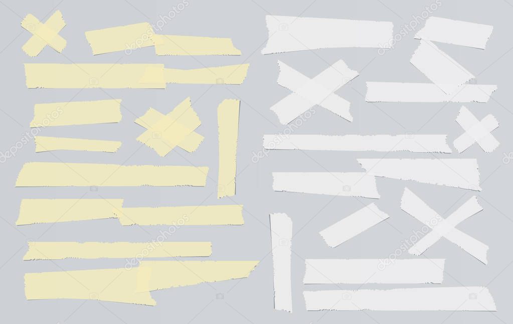 White and yellow adhesive, sticky, masking, duct tape, paper strips pieces for text on gray background
