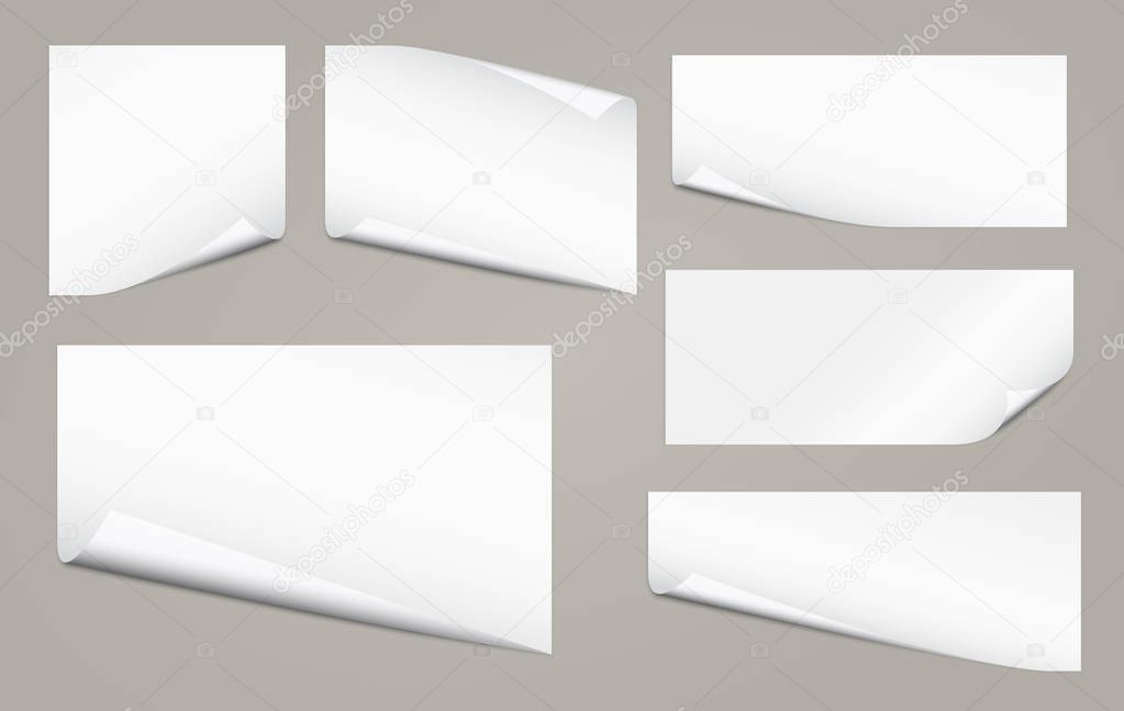 Set of white notebook paper with curled corners for text or advertising message on gray background