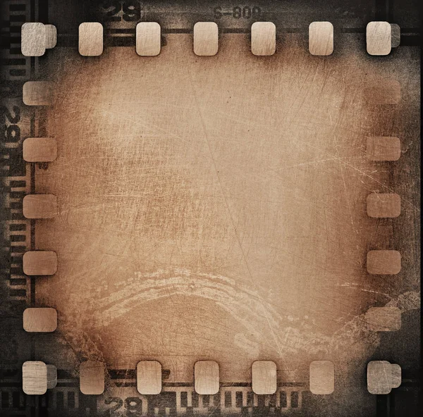 Grunge marrone graffiato sporco pellicola striscia fondo . — Foto Stock