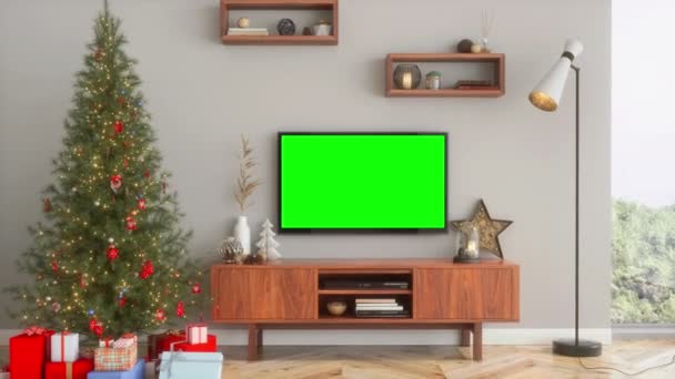 緑色の画面が付いている液晶テレビ クリスマスツリーとプレゼント — ストック動画