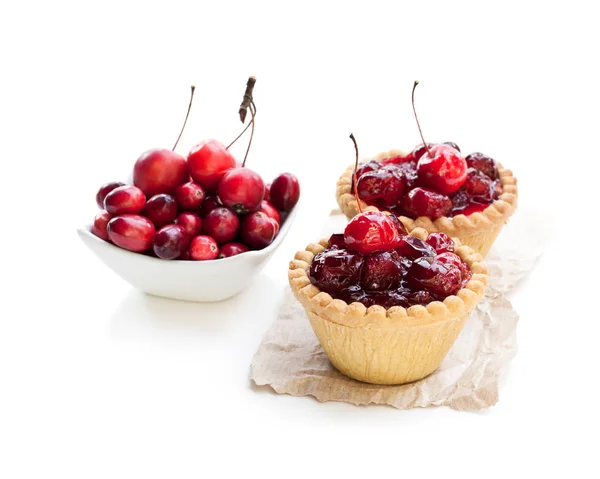 egg  custard tarts with cranberry jam isolated on white