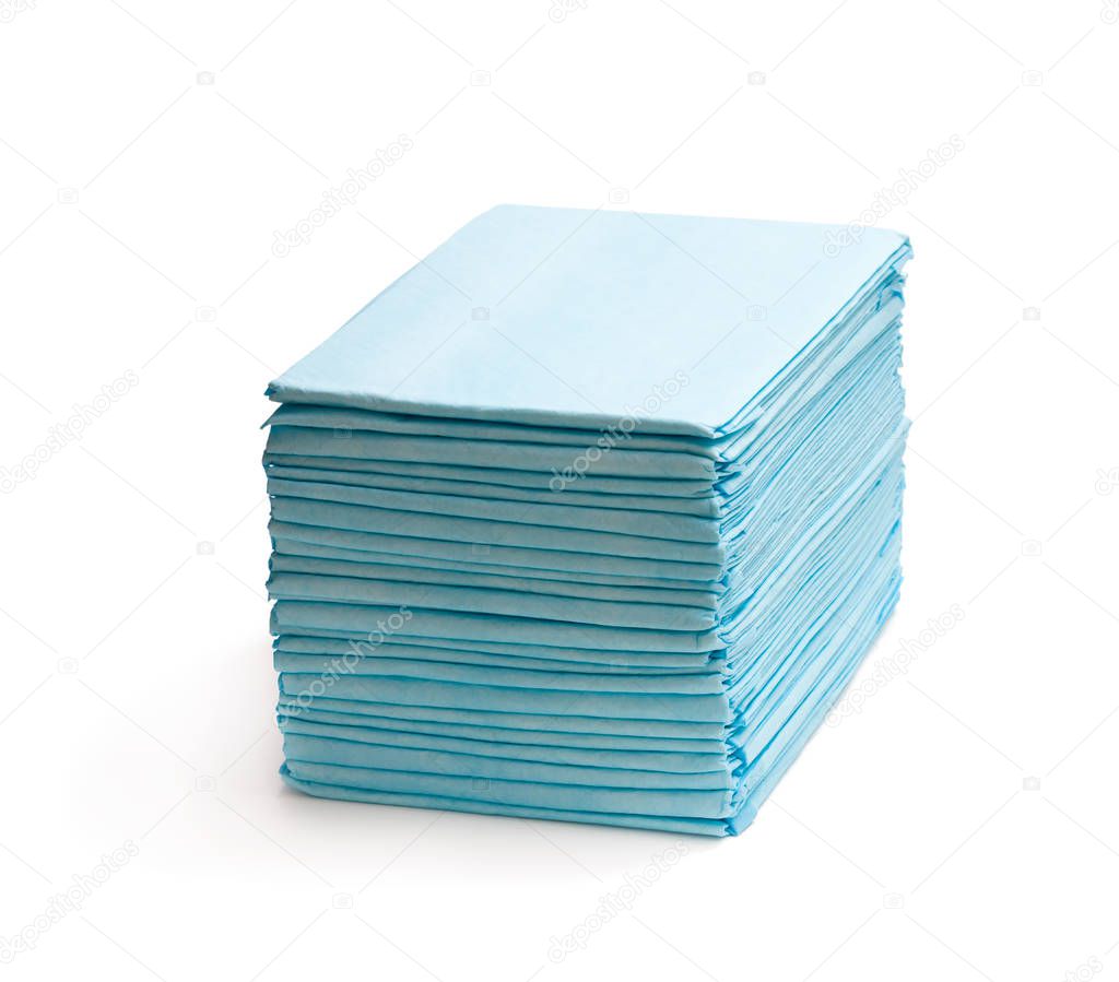 Stack  of disposable bed pads isolated on white 