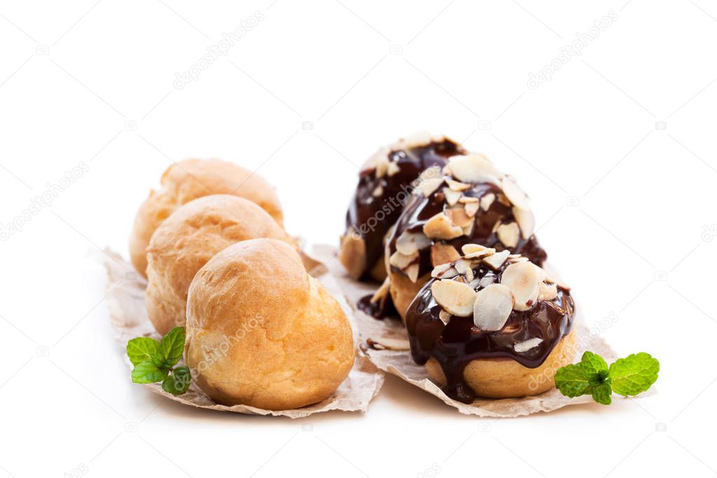 Homemade  assorted profiteroles isolated on white 