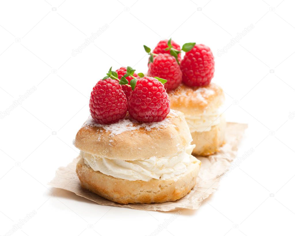 Traditional  scones with raspberry and cream isolated on white 