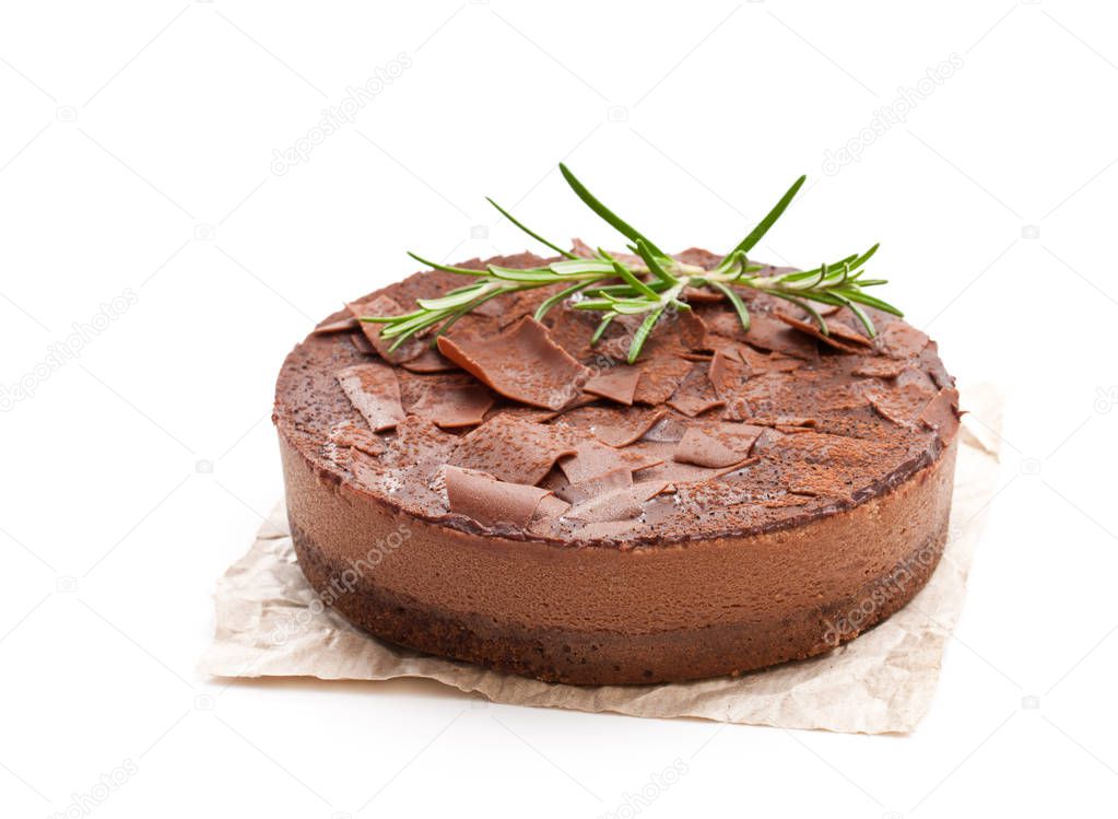 Baked  belgian chocolate cheesecake with chocolate ganache isolated on white 