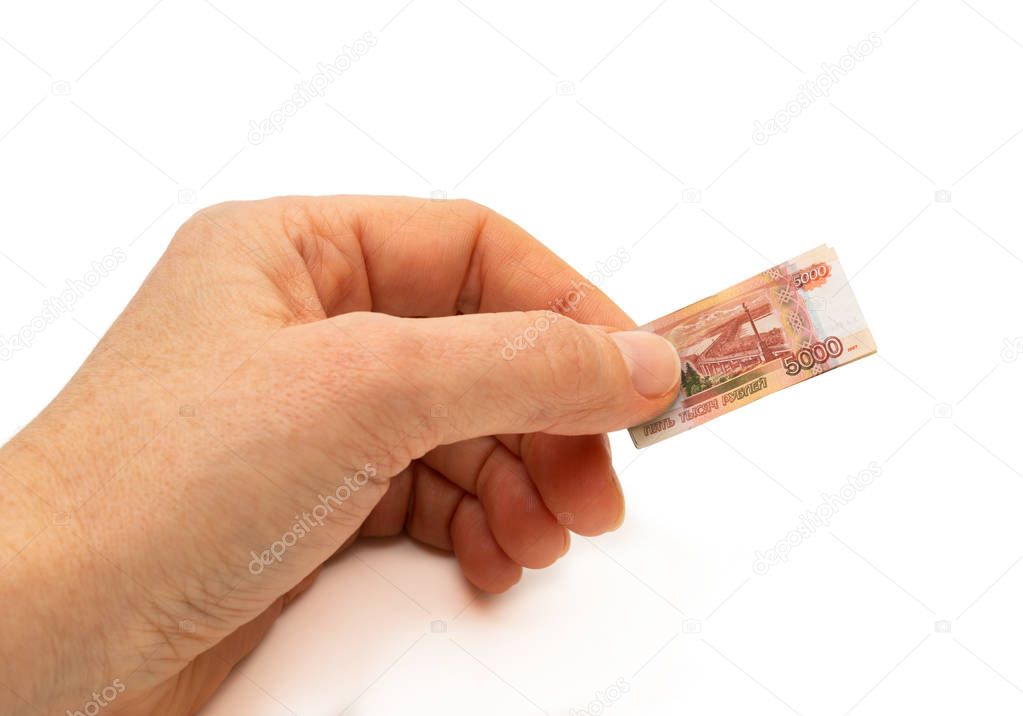 Finance concept hand holding inflated russian 5000 rubles bank note 