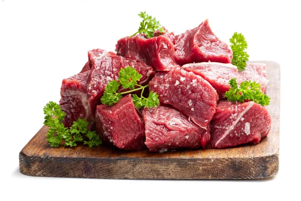 Sliced raw beef with parsley herb isolated on white — Stock Photo, Image