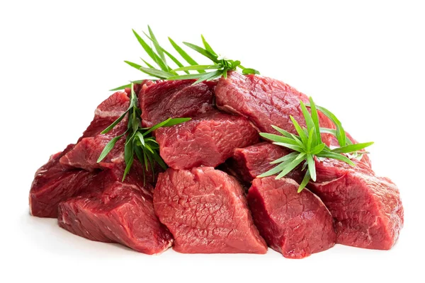 Sliced raw beef with tarragon herb isolated on white — Stock Photo, Image