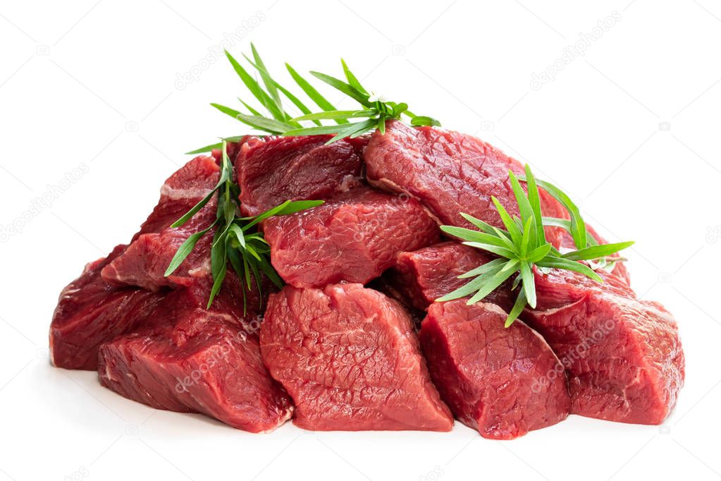 Sliced raw beef with tarragon herb isolated on white 