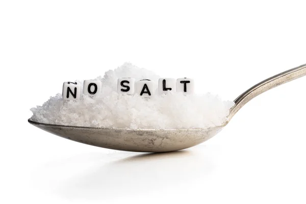 Spoon full of sea salt. No salt concept — Stock Photo, Image