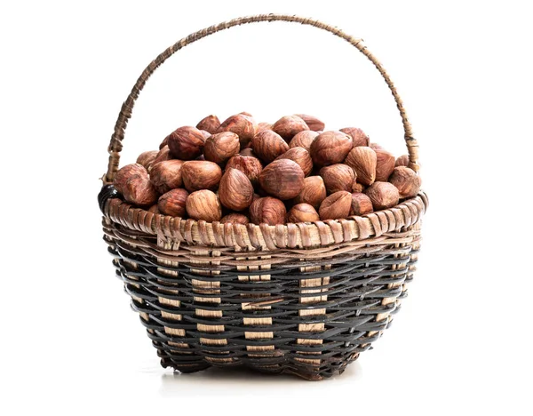 Small basket full of hazelnut kernels isolated on white — Stock Photo, Image
