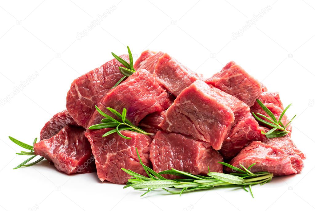 Sliced  raw beef with tarragon herb isolated on white 