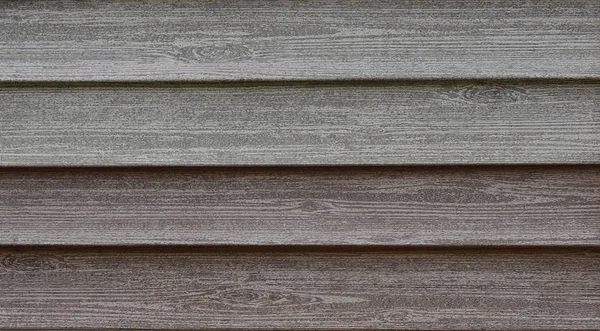 The texture of the wooden strips on the facade of the building