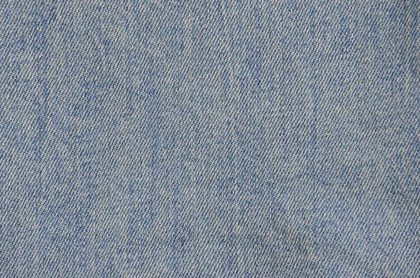 軽い糸を持つ青いジーンズの質感 テクスチャインサート付きストレッチジーンズ — ストック写真