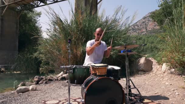 Guy Plays Drums Coolly Nature Expressive Performance Medium Shot Royalty Free Stock Footage