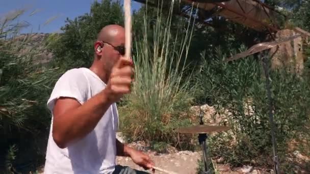 Guy Plays Drums Coolly Nature Expressive Performance Low Angle Medium Stock Video