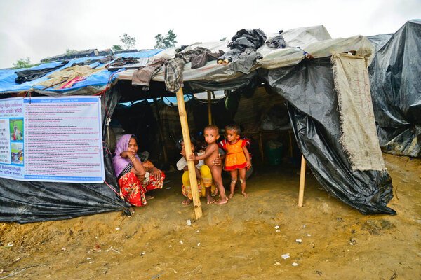 A Rohingya refugee family member sits in their house at the Thengkhali makeshift Camp in Cox's Bazar, Bangladesh, on September 06, 2017. More than 600,000 Rohingya have arrived in Bangladesh since a military crackdown in neighboring Myanmar in August