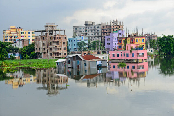 Houses seen surrounded by the flood water at Lowland area of the Dhaka City in Bangladesh, on August 6, 2020