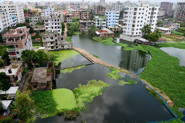 Houses are seen surrounded by the flood water at Lowland area of the Dhaka City in Bangladesh, on August 8, 2020