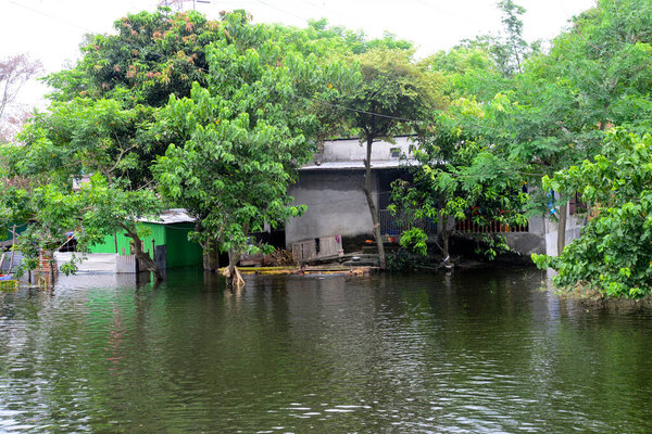 Village house are seen surrounded by the flood water in Savar near Dhaka, Bangladesh, on August 10, 2020