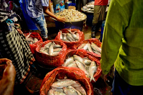 Bangladeshi vendors sell Hilsa fish at the Karwan Bazar wholesale fish market in Dhaka, Bangladesh, on September 10, 2020