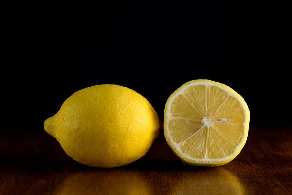 Lemon fruits on black background