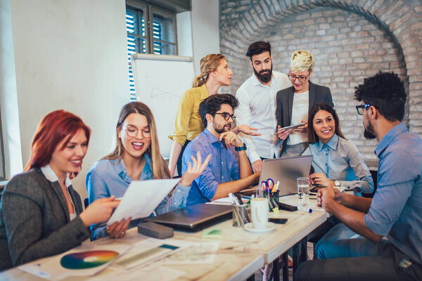 Business colleagues in conference meeting room discussing presentation