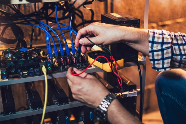 Programmer configuring hardware for bitcoin mining