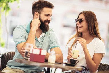 Beautiful couple having coffee on a date clipart