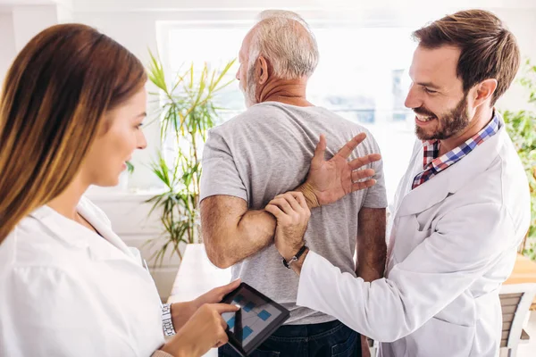 Man Having Chiropractic Arm Adjustment Physiotherapy Sport Injury Rehabilitation Senior — Stock Photo, Image