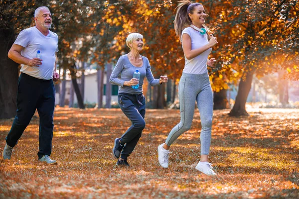 Senior Man Woman Young Female Instructor Workout Fresh Air Outdoor — Stock Photo, Image