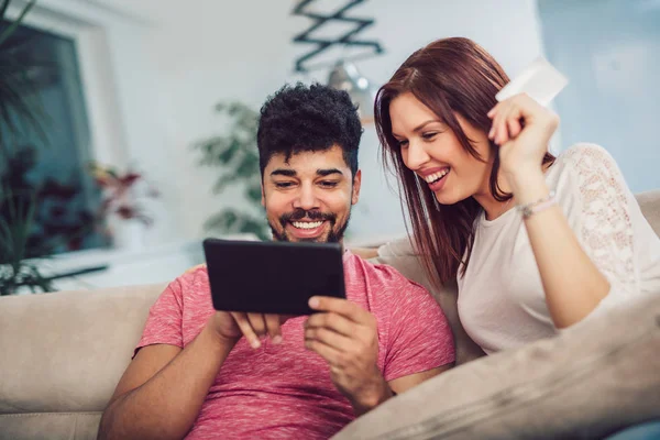 Happy Mixed Race Couple Shopping Online Home Using Credit Card — Stock Photo, Image