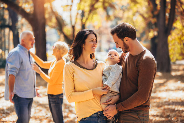 Multi generation family in autumn park