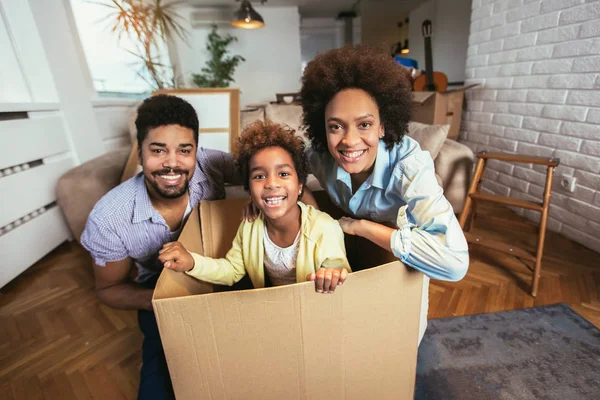African American Family Parents Daughter Unpacking Boxes Moving New Home — Stock Photo, Image