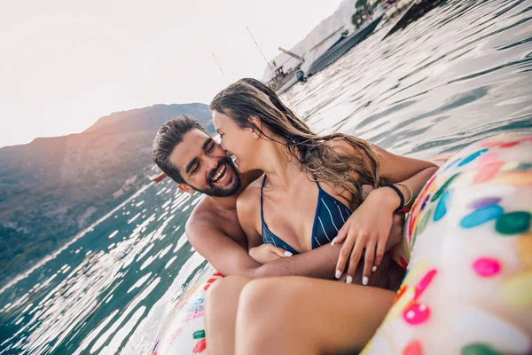 Happy couple resting at sea resort, having fun.