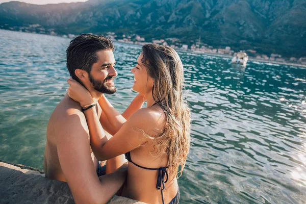 Sexy young loving couple on the beach having fun — Stock Photo, Image