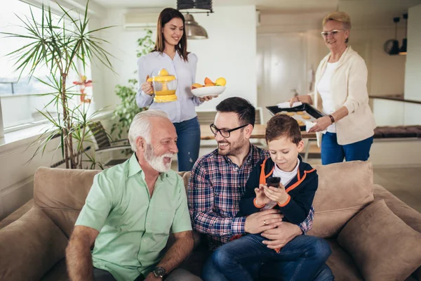 Portrait of a three generation family spending time together at — Stock Photo, Image