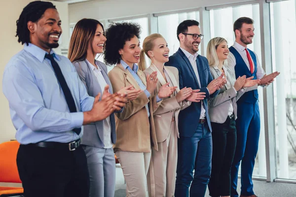 Group of businesspeople clapping in office. — Stock Photo, Image