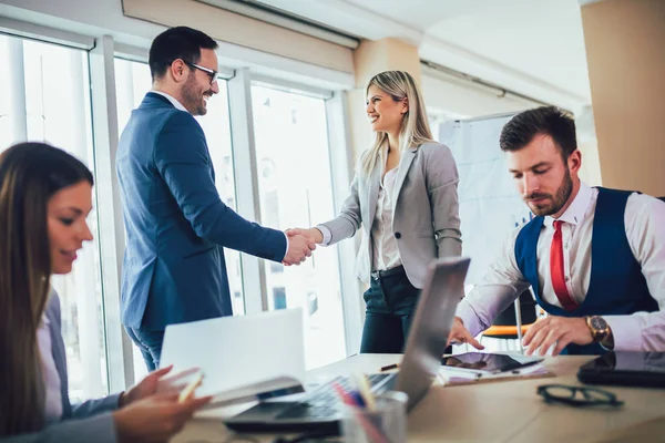 Business people shaking hands in meeting room. Selective focus. — Stock Photo, Image