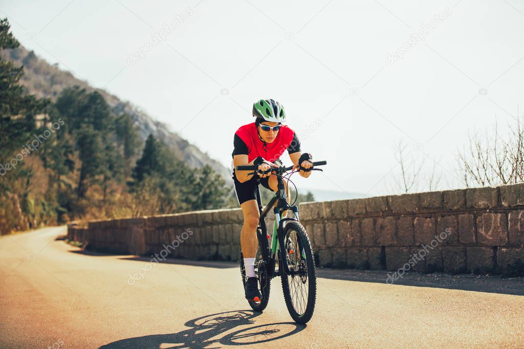 Man ride mountain bike on the road. Sport and active life concep