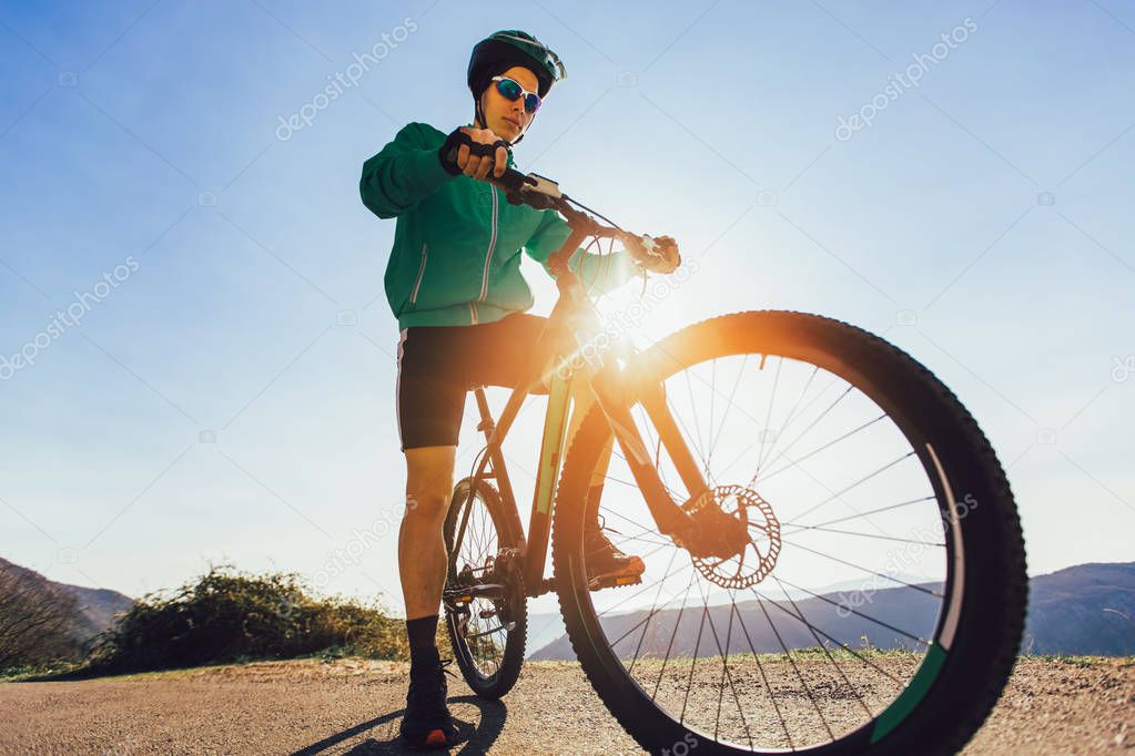 Man ride mountain bike on the road. Sport and active life concep