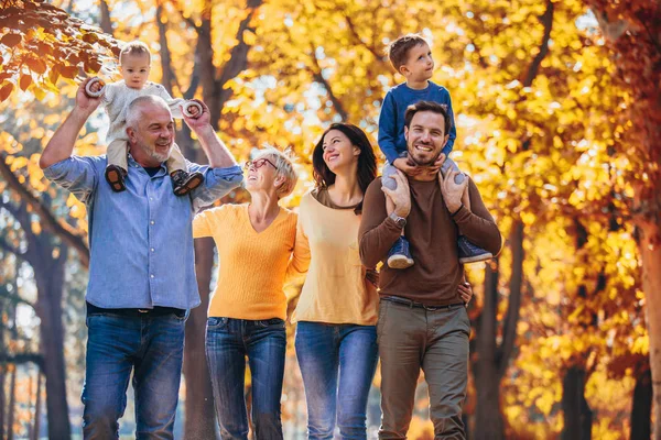 Multl generation family in autumn park having fun — Stock Photo, Image